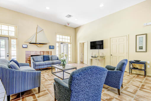 a living room filled with furniture and a large window