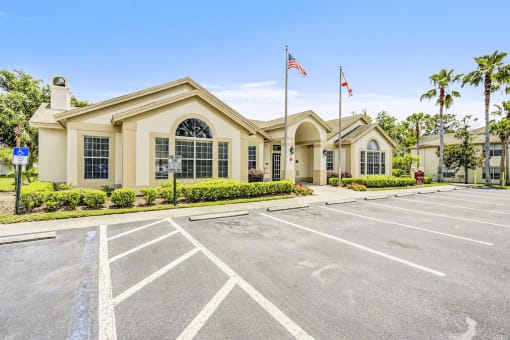 Clubhouse entrance with beautiful landscaping.