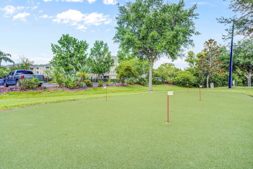 a putting green at the enclave at woodbridge apartments in sugar land, tx