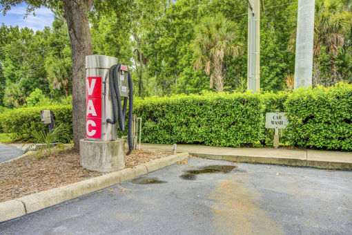 Parking space with a coin-operated car vacuum.