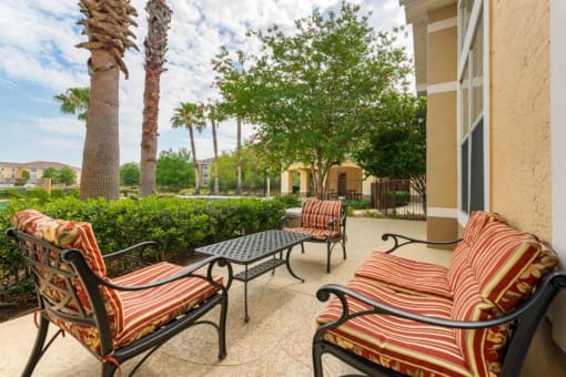 Outdoor Lounge Seating Surrounded by Trees and Landscaping
