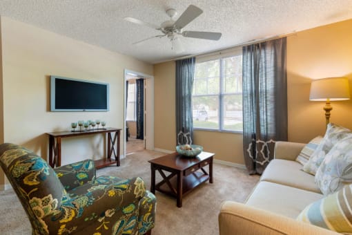 Furnished Living Room with White Ceiling Fan