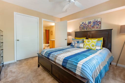 Furnished Carpeted Bedroom with Connected Bathroom