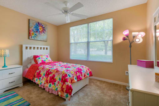 Furnished Carpeted Bedroom with Large Window
