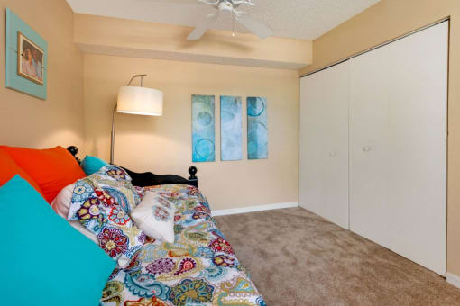 Furnished Carpeted Bedroom with Large Sliding Closet