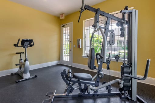 Bright Fitness Center with Exercise Equipment  and Large Windows