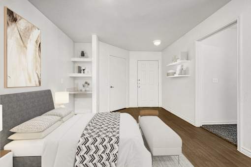 Bedroom with shelving and entrance door at Tierra Antigua Apartments, Mesa
