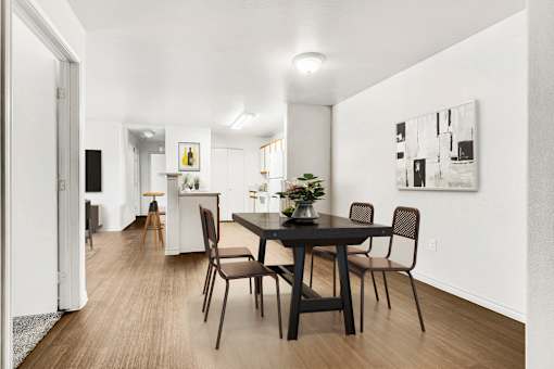 Dining room with black table and modern artwork at Tierra Antigua Apartments, Mesa, AZ 85207