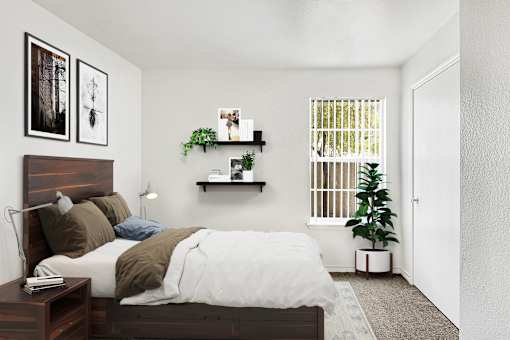 Bedroom with dark wood furniture and floating shelves at Tierra Antigua Apartments, Mesa
