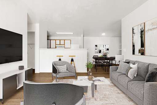 Open floor plan with gray sofa and dining area at Tierra Antigua Apartments, ARIZONA, 85207