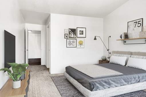 Modern bedroom with platform bed and gallery wall at Tierra Antigua Apartments, Mesa