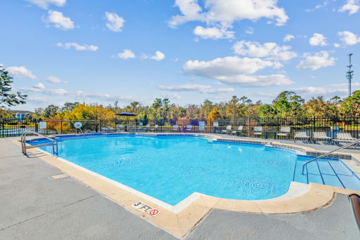 the resort style pool at the enclave at woodbridge apartments in sugar land, tx