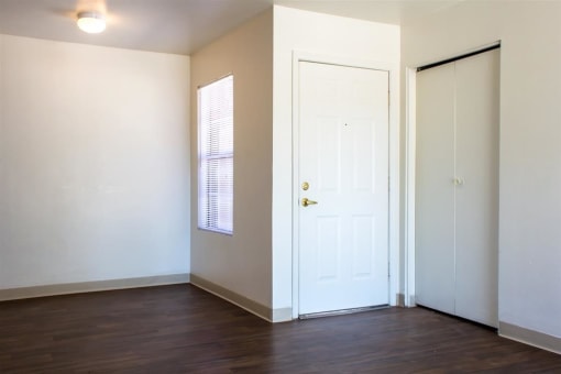 Living Room Entry with Hardwood Style Flooring and Window