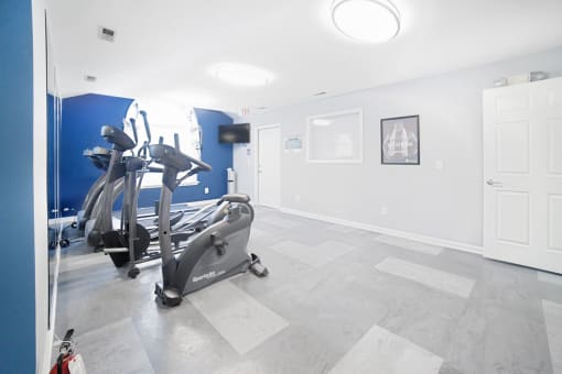 Fitness center with cardio equipment with large window