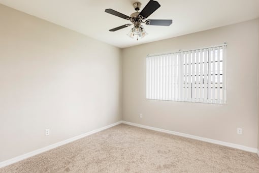 Carpeted Bedroom with Open Window