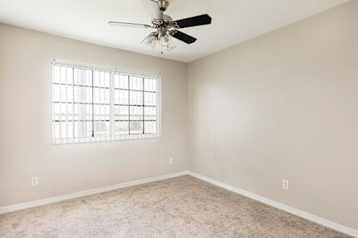 Carpeted Bedroom with Open Window