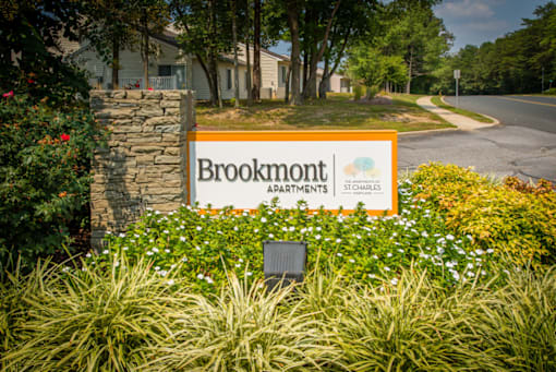 a sign at the entrance of brookmont apartments
