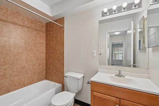 A bathroom with a white toilet and sink.