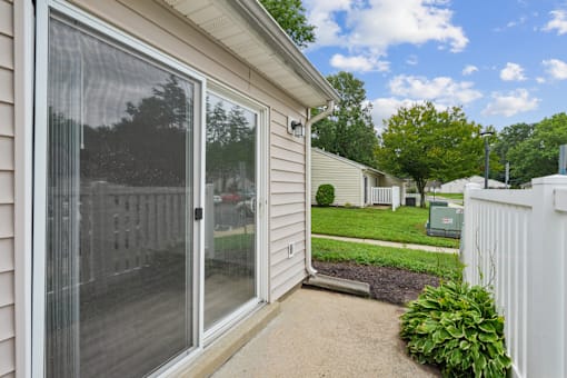 apartment patio with a sliding glass door