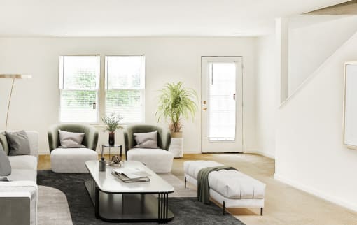 Virtually staged living room interior with grey rug, side chairs, and glass coffee table. Large window in background next to font door/entryway