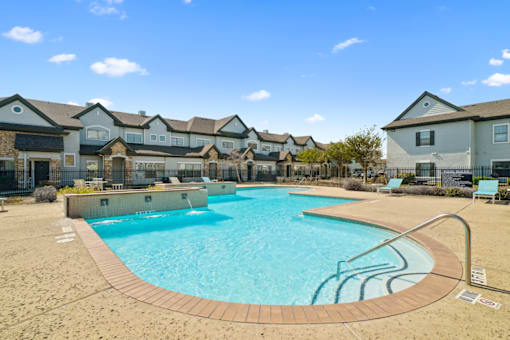 our apartments have a large resort style pool with apartments in the background