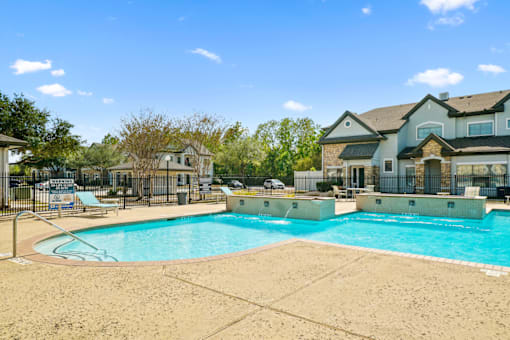 the swimming pool at the preserve at polo ridge apartments