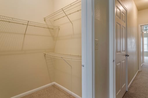 the walk in closet at the flats at big tex apartments in ft worth