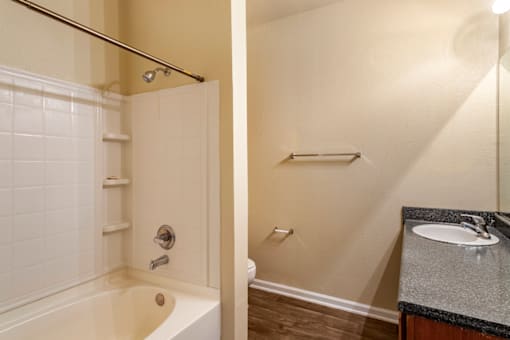 a bathroom with a bathtub and a sink