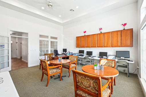 a room filled with furniture and a large window