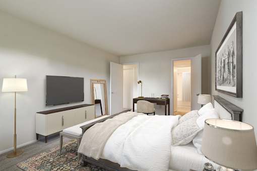 a bedroom with a bed and a tv