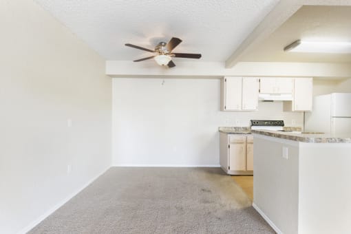 Open Carpeted Dining Area Next to Kitchen with Breakfast Bar