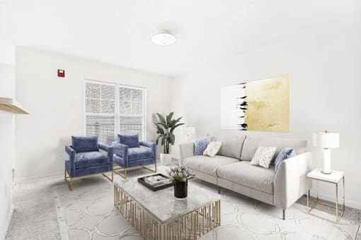 Virtually staged carpeted living room with grey couch and accent chairs with coffee table and modern artwork. Large window and entryway in background