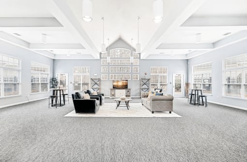 Spacious Open Clubhouse Seating Area with Couches Chairs Tables and Coffee table