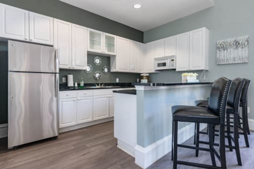 With White Cabinets Black Counters Stainless Steel Appliances