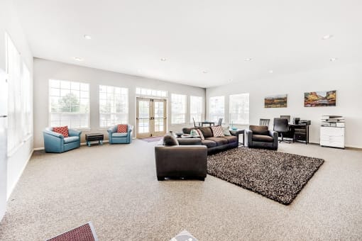 Clubhouse Lounge with Armchairs and Desk with Chair