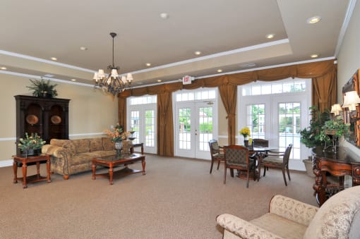 Resident lounge area with sofa coffee table and large French door leading to outside