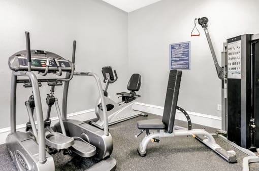 Fitness center with cardio and strength training machines.