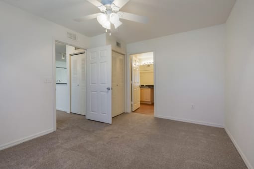 Carpeted Bedroom with En-Suite Bathroom and Ceiling  Fan