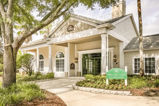 Leasing office exterior surrounded by native landscaping