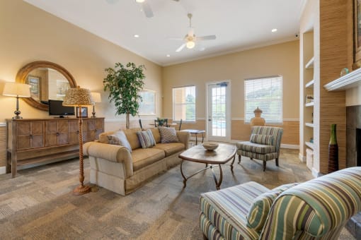 Club house lounge with couches, coffee table and credenza
