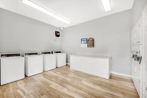 Clothing care center with washers, dryers, and folding station