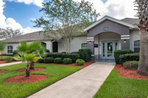 Leasing office exterior with native landscaping