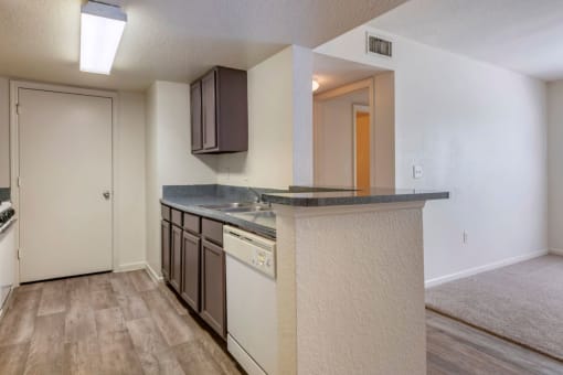 Kitchen with hardwood style flooring and breakfast bar
