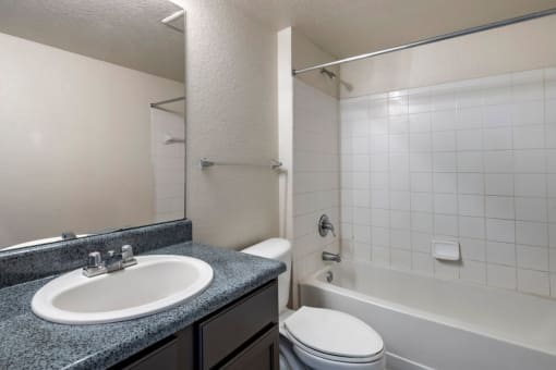 Bathroom with large mirror and tiled shower
