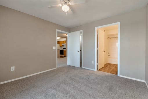 Bedroom with carpet flooring and en-suite bathroom