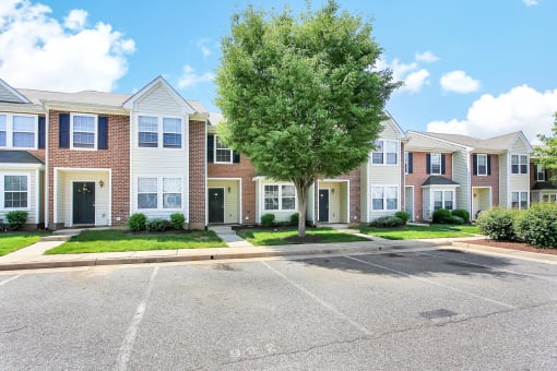 2 story Building exterior with green doors and shutters