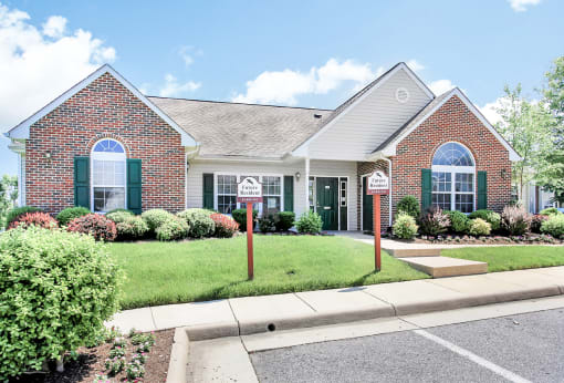 Front of the leasing office with parking spaces for new residents