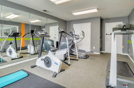 Fitness center with treadmill and stationary bikes