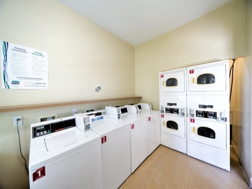 Clothing care center with washers, dryers, and folding station