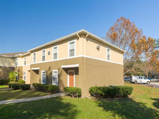 Apartment Building Exterior Surrounded By Native Landscaping at Holly Cove Apartments, Florida, 32073